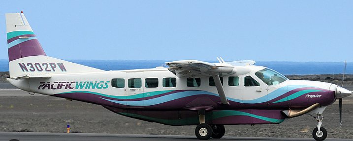 Pacific Wings Cessna Grand Caravan N302PW taxiing with the ocean behind